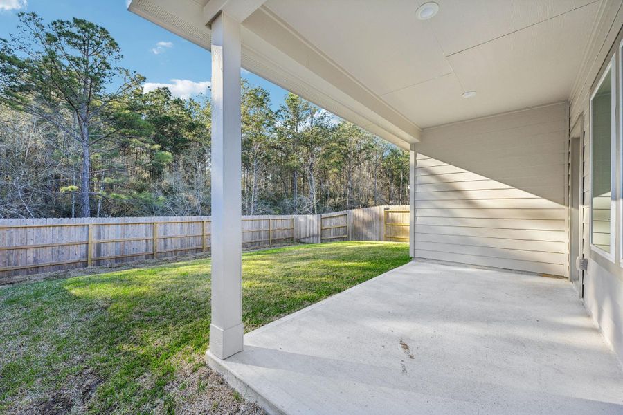 Exterior details and patio area of a home in Landing Meadows - Traditional Series, New Caney (Image 22).