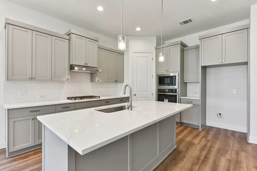 Furnished interior view inside a new home in 6 Creeks, Kyle (Image 4).