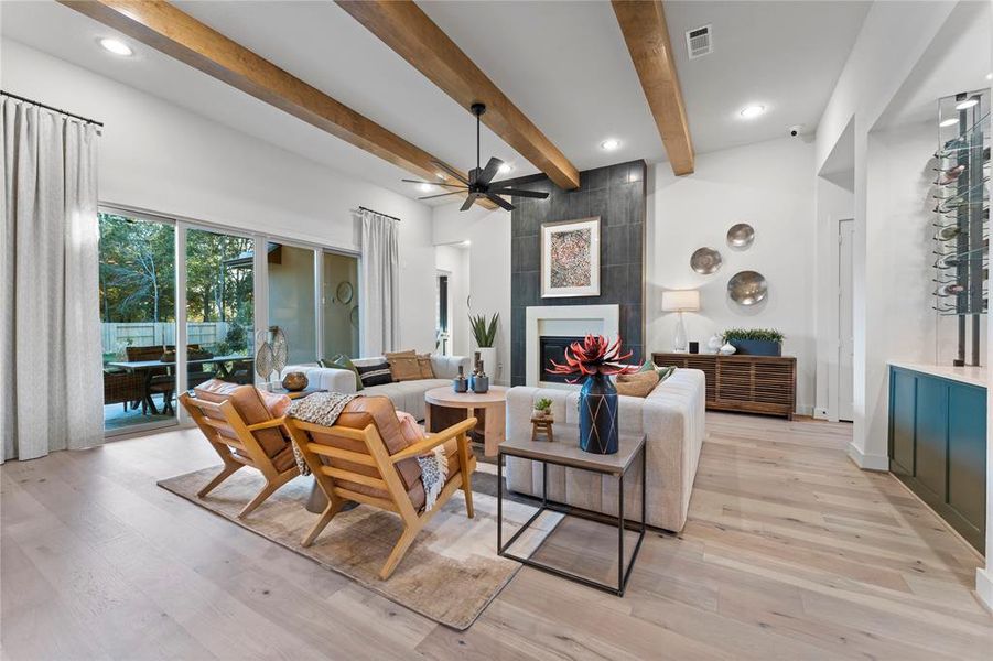 Family Room with Ceiling Beams, Gas Fireplace and Custom Slider Doors