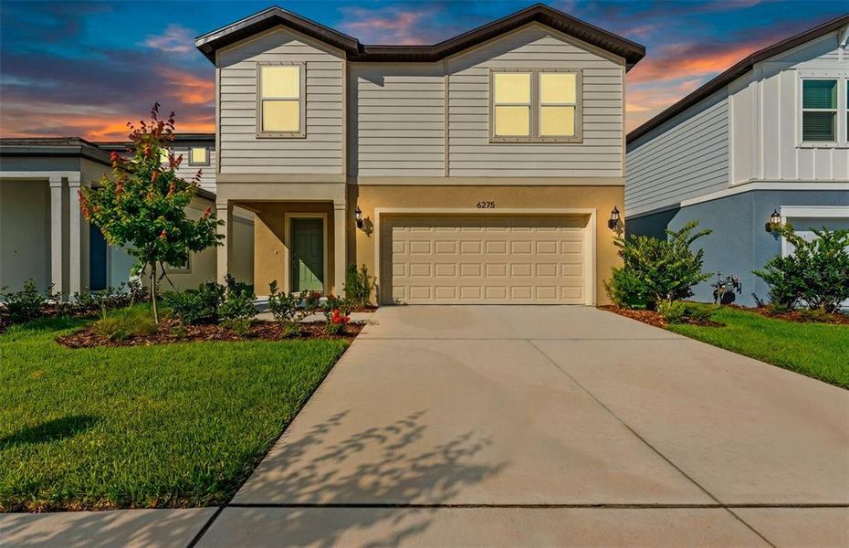 Front exterior of a new home in Waterset, Apollo Beach, FL, highlighting curb appeal (Image 2). Front exterior of a new home in Waterset, Apollo Beach, FL, highlighting curb appeal (Image 2).