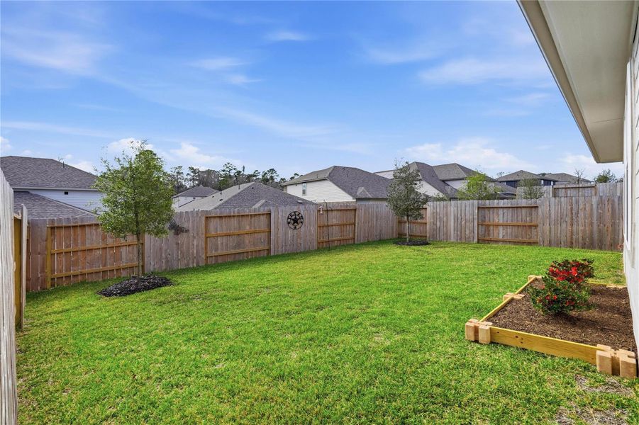 Plant a garden, add a play set for the kids, or create an outdoor retreat in this peaceful backyard.