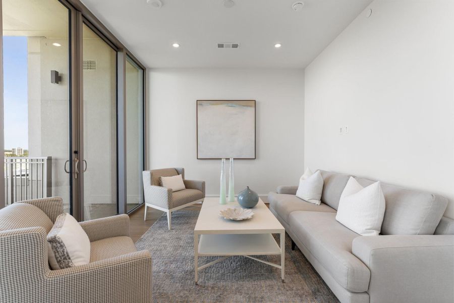 Alternate view of the attached primary living room with an option use as a study or private office. Alternate view of the attached primary living room with an option use as a study or private office.