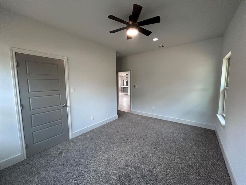 Unfurnished bedroom featuring carpet, a ceiling fan, and recessed lighting Unfurnished bedroom featuring carpet, a ceiling fan, and recessed lighting