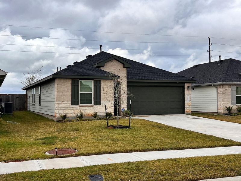 Front exterior of a new home in Tamarron, Fulshear, TX, highlighting curb appeal (Image 15).