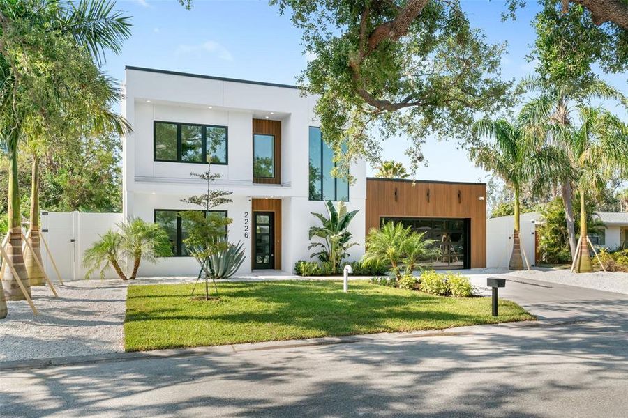 Front exterior of a new home in , Sarasota, FL, highlighting curb appeal (Image 32).