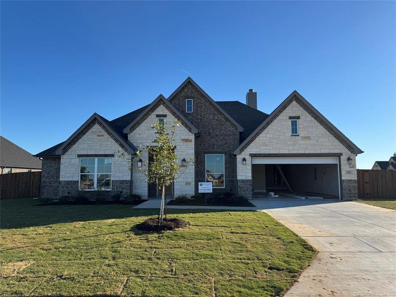 Front exterior of a new home in Coyote Crossing, Godley, TX, highlighting curb appeal (Image 1). Front exterior of a new home in Coyote Crossing, Godley, TX, highlighting curb appeal (Image 1).