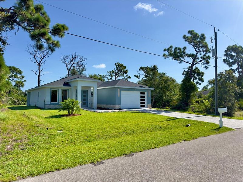 Front exterior of a new home in , Rotonda West, FL, highlighting curb appeal (Image 28). Front exterior of a new home in , Rotonda West, FL, highlighting curb appeal (Image 28).