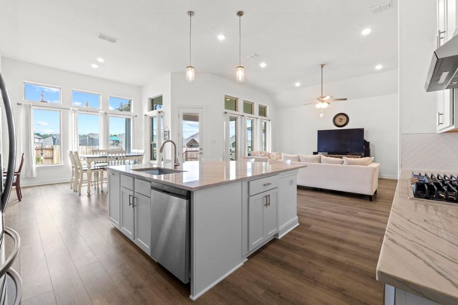 Strategically placed transom windows and oversized glass doors ensure the home is always bright and welcoming.