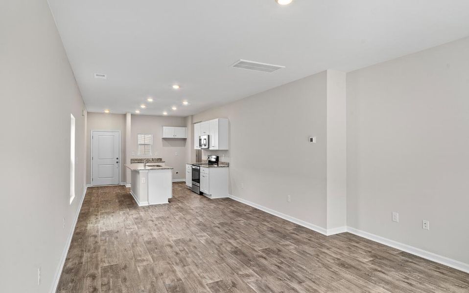 Spacious, unfurnished interior of a new home in Lindera Preserve at Cane Bay Plantation: American Dream Series - Ph 15, Summerville (Image 10). Spacious, unfurnished interior of a new home in Lindera Preserve at Cane Bay Plantation: American Dream Series - Ph 15, Summerville (Image 10).