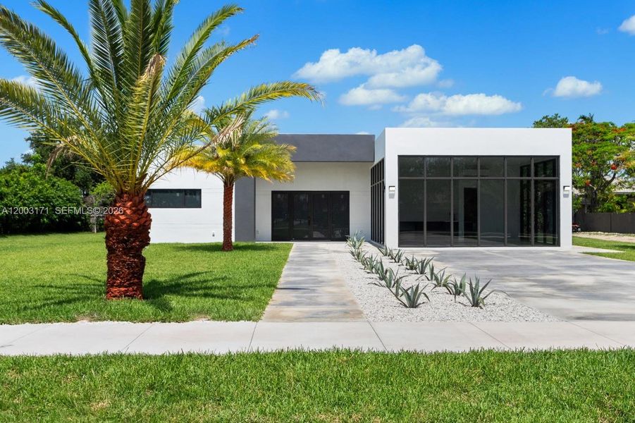 Front exterior of a new home in , Homestead, FL, highlighting curb appeal (Image 16).