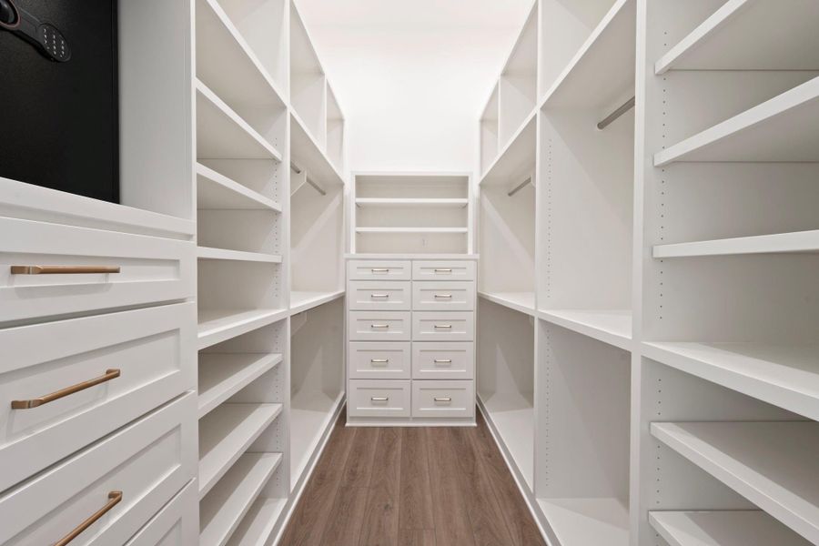 Huge master closet with tons of built ins and storage