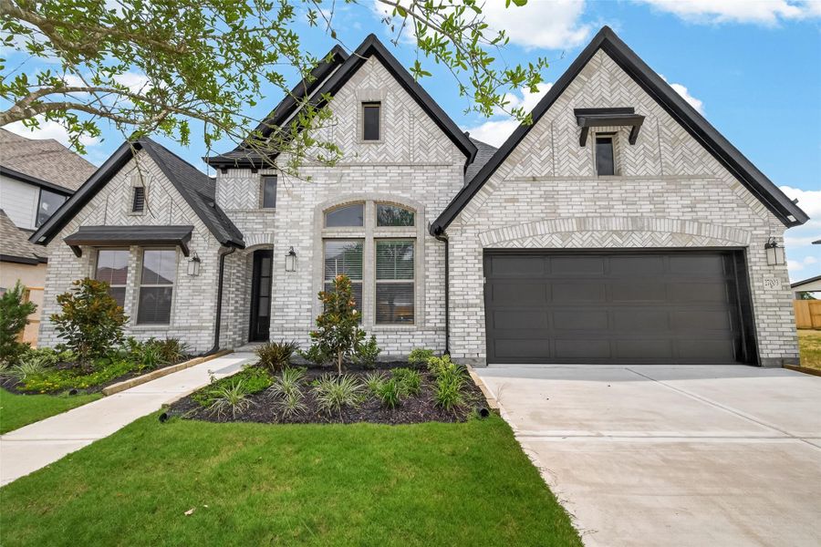 Front exterior of a new home in , Richmond, TX, highlighting curb appeal (Image 27).