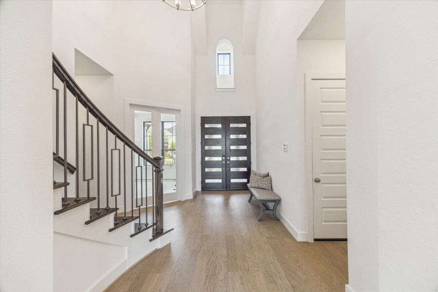 The soaring ceiling is the first thing you wil notice and then the beautiful neutral hardwood floors as you enter into this two story home through the double wood and glass doors. The soaring ceiling is the first thing you wil notice and then the beautiful neutral hardwood floors as you enter into this two story home through the double wood and glass doors.