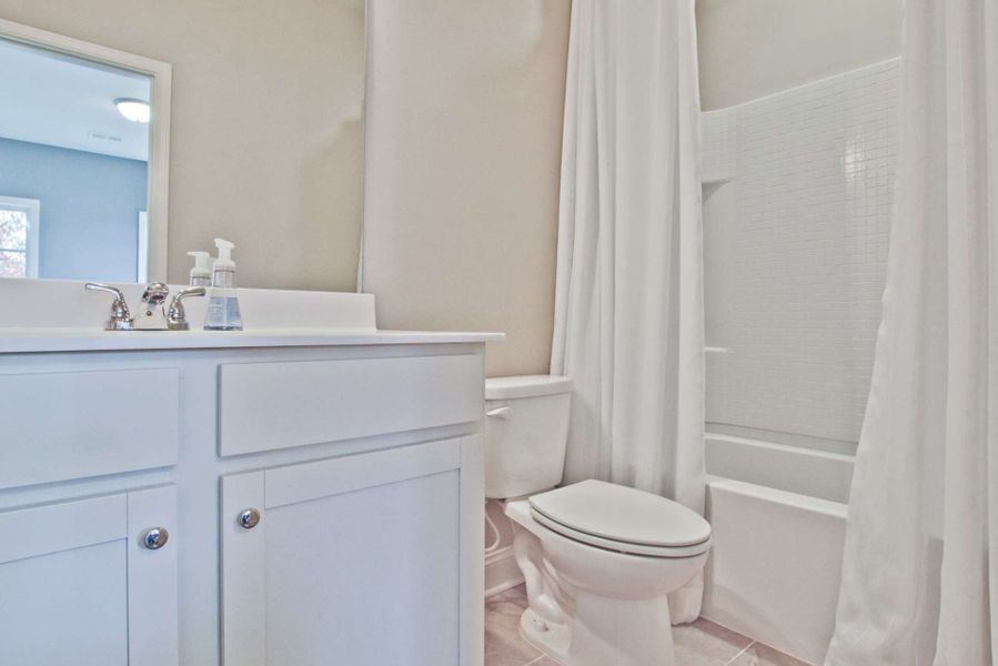 Representative furnished interior of a home built from the Barwick by KM Homes in Nickel Creek at Newnan Crossing, Newnan (Image 28).