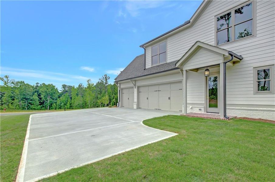 Front exterior of a new home in , Newnan, GA, highlighting curb appeal (Image 31). Front exterior of a new home in , Newnan, GA, highlighting curb appeal (Image 31).