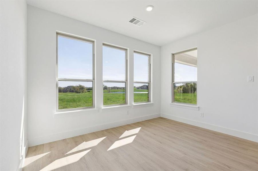 Unfurnished room featuring light wood-style flooring and recessed lighting