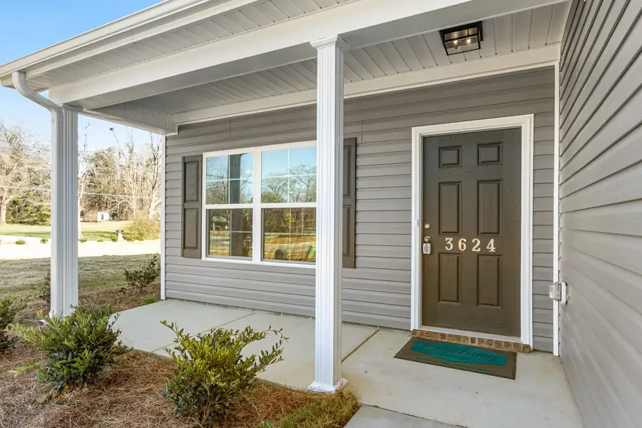 Exterior details and patio area of a home in The Wilcox, Greensboro (Image 3). Exterior details and patio area of a home in The Wilcox, Greensboro (Image 3).
