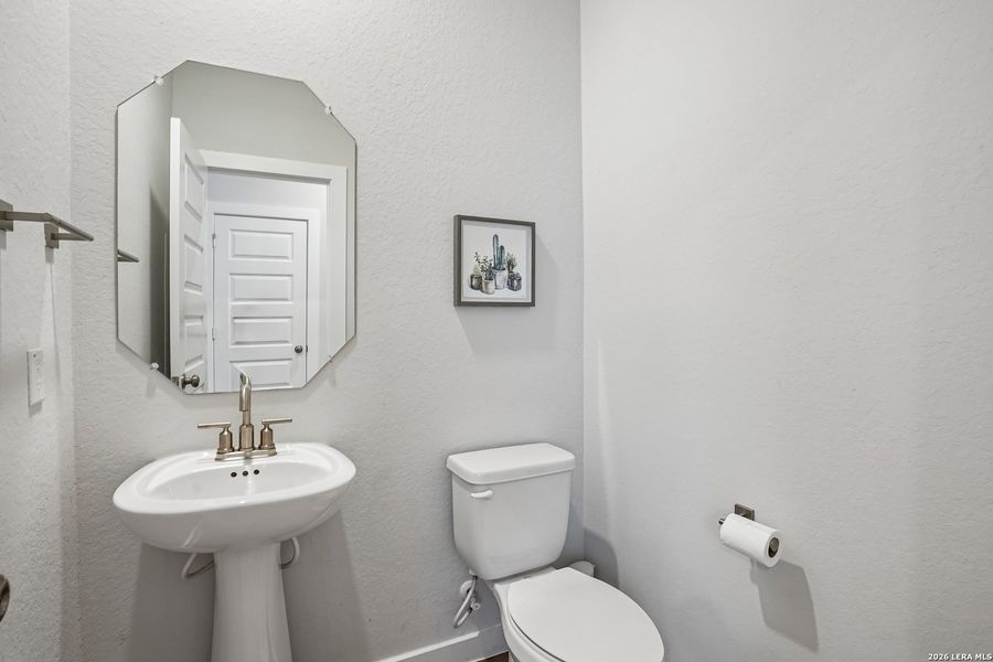 Furnished interior view inside a new home in University Village, San Antonio (Image 17).