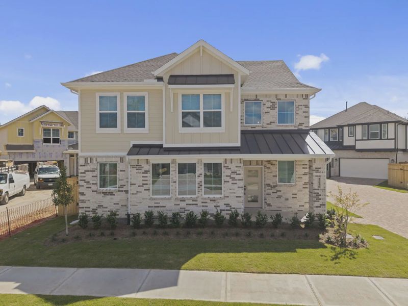 Representative exterior photo of a completed home built from the Dillon by Chesmar Homes in Sienna Courtyard, Missouri City, TX (Image 22).