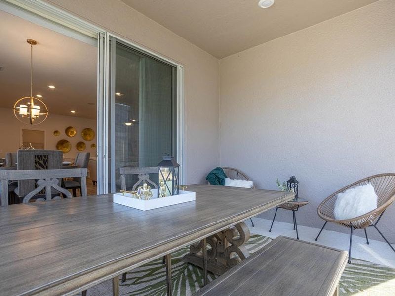 Your living space extends outdoors to a covered lanai - Shelby II by Highland Homes