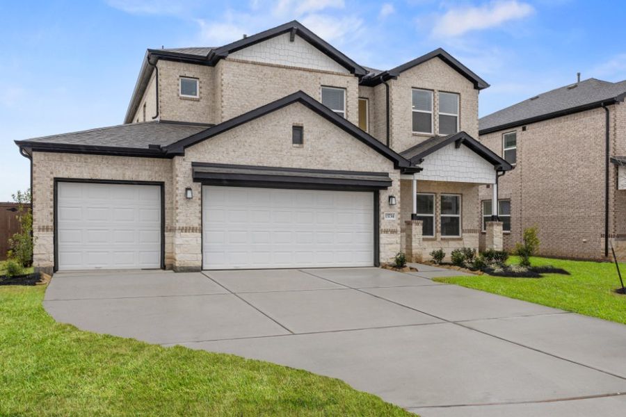 Front exterior of a new home in Creekhaven, Rosharon, TX, highlighting curb appeal (Image 21).