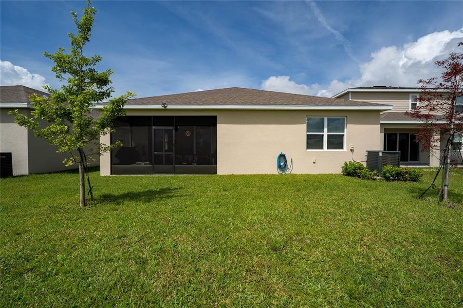 Exterior details and patio area of a home in Seasons at Big Sky, Kissimmee (Image 4).