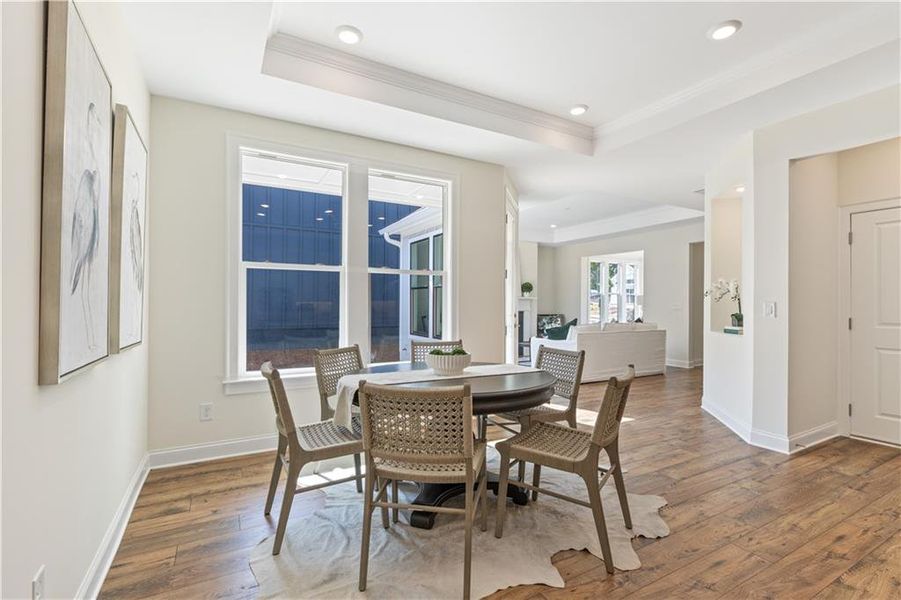 Furnished interior in a model home at The Courtyards by The Manor in Alpharetta (Image 6).