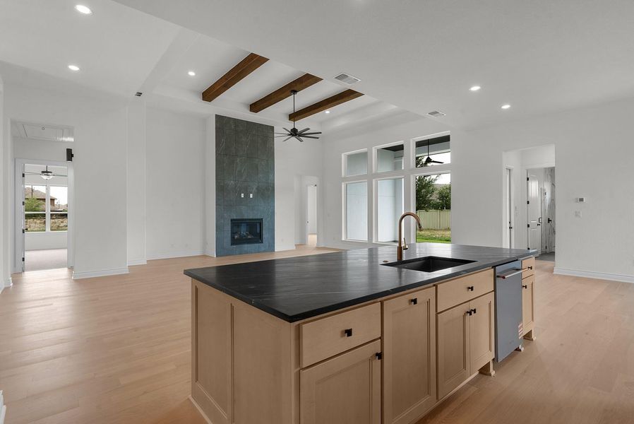 A grand, open-concept living space highlights a statement fireplace and expansive windows, perfect for gracious entertaining. A grand, open-concept living space highlights a statement fireplace and expansive windows, perfect for gracious entertaining.