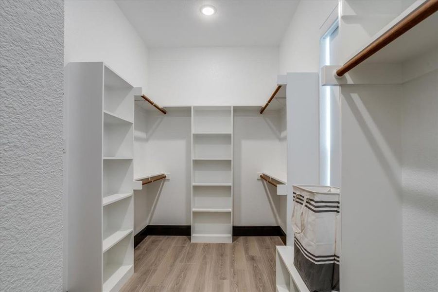 Walk in closet featuring light tile flooring