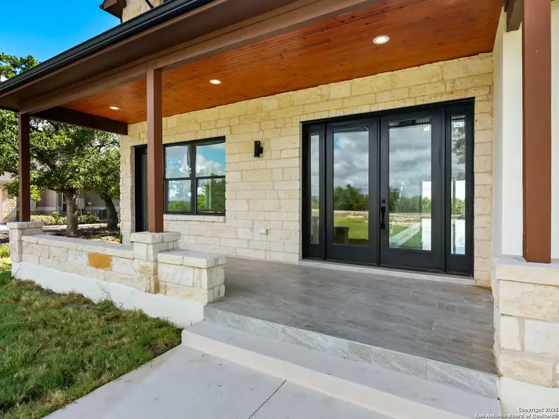 Exterior details and patio area of a home in , Spring Branch (Image 4).