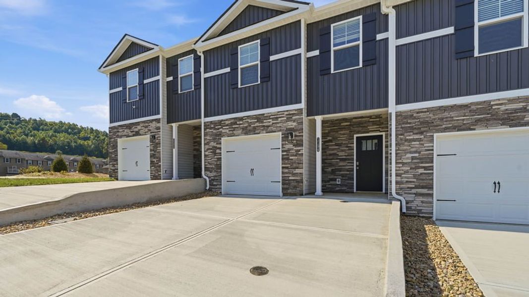 Front exterior of a new home in The Arbor Townhomes, Kingsport, TN, highlighting curb appeal (Image 13).