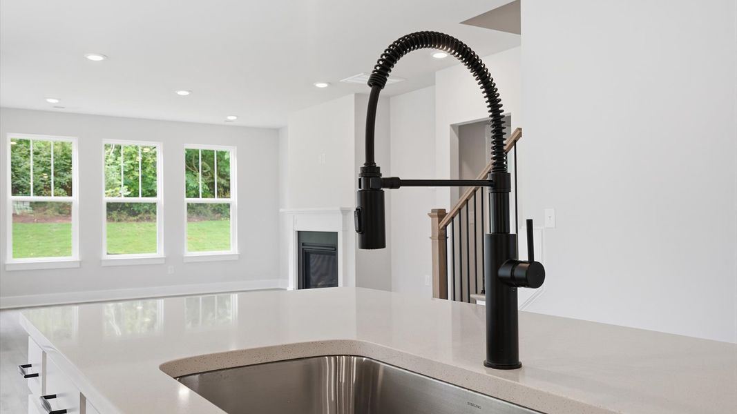 First-rate kitchen with functional layout, black hardware, and a large center island near Downtown Anderson