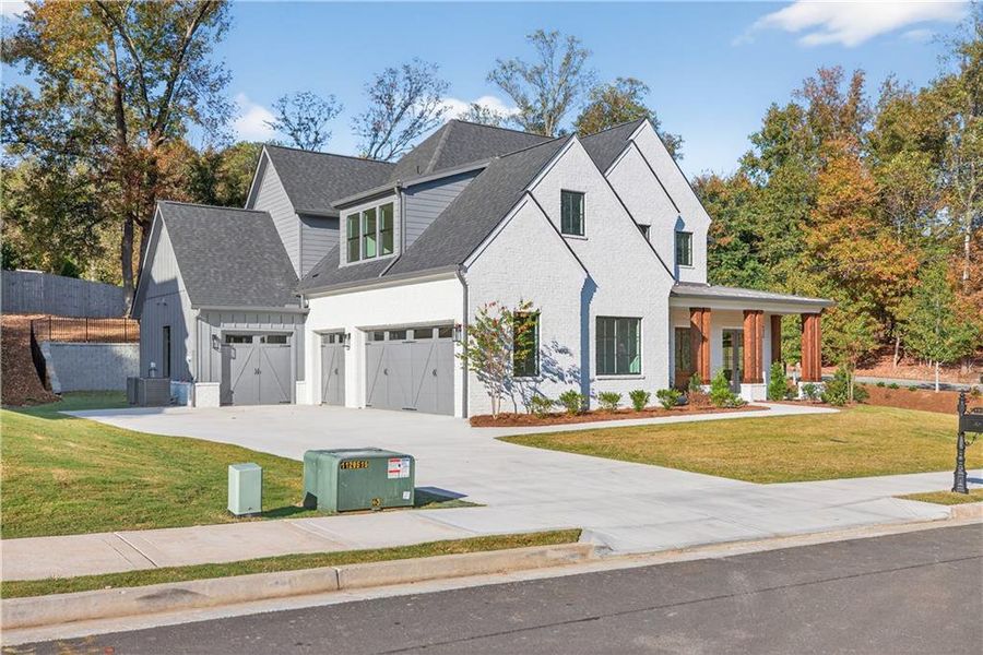 Front exterior of a new home in Town Farms, Peachtree Corners, GA, highlighting curb appeal (Image 2).