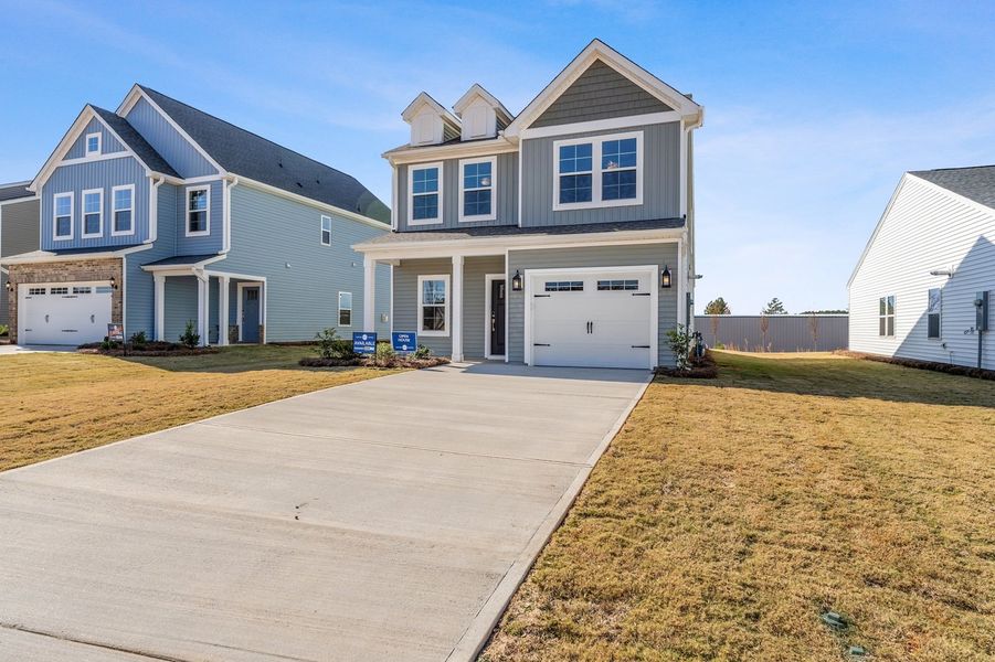 Front exterior of a new home in Tucker Ridge, Pendleton, SC, highlighting curb appeal (Image 2). Front exterior of a new home in Tucker Ridge, Pendleton, SC, highlighting curb appeal (Image 2).