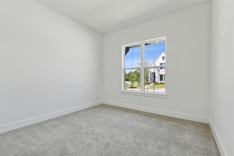 Neutral-toned carpeting paired with white baseboards and walls Neutral-toned carpeting paired with white baseboards and walls