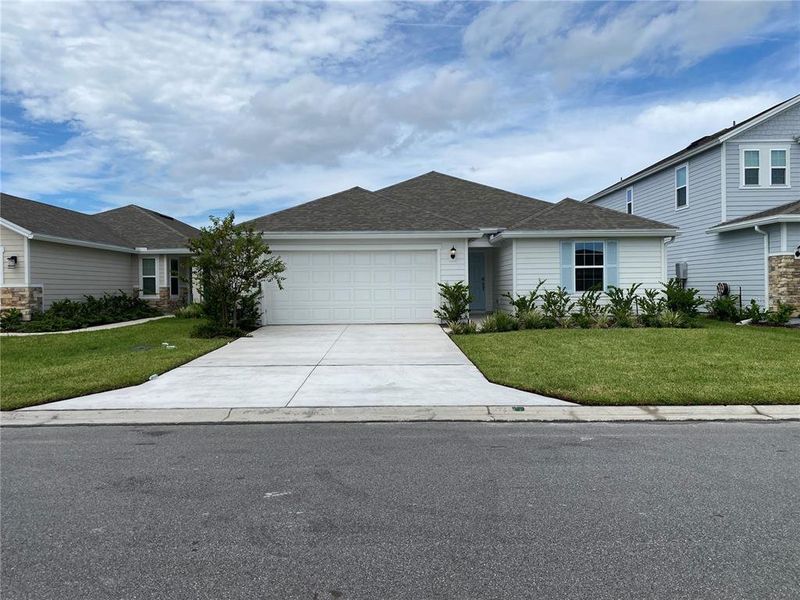 Front exterior of a new home in Somerset - Executive Series, Palm Coast, FL, highlighting curb appeal (Image 1).