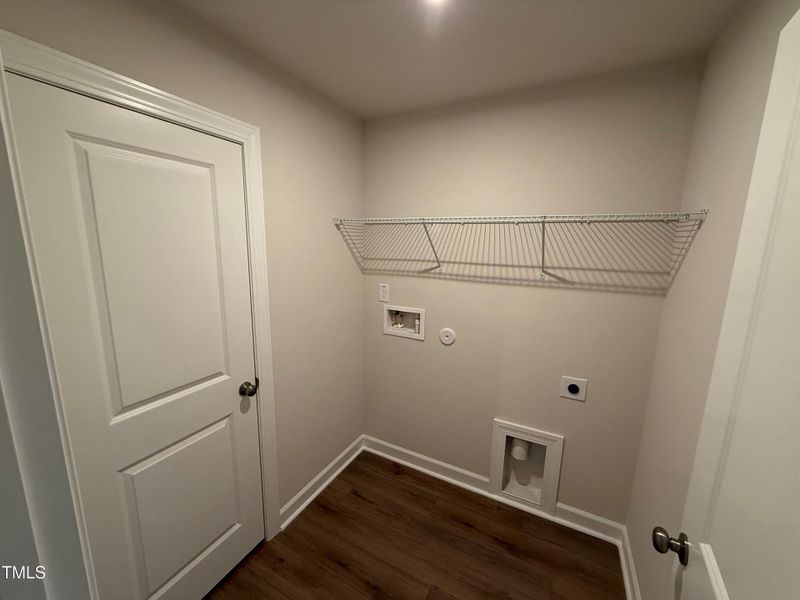 laundry room with linen closet