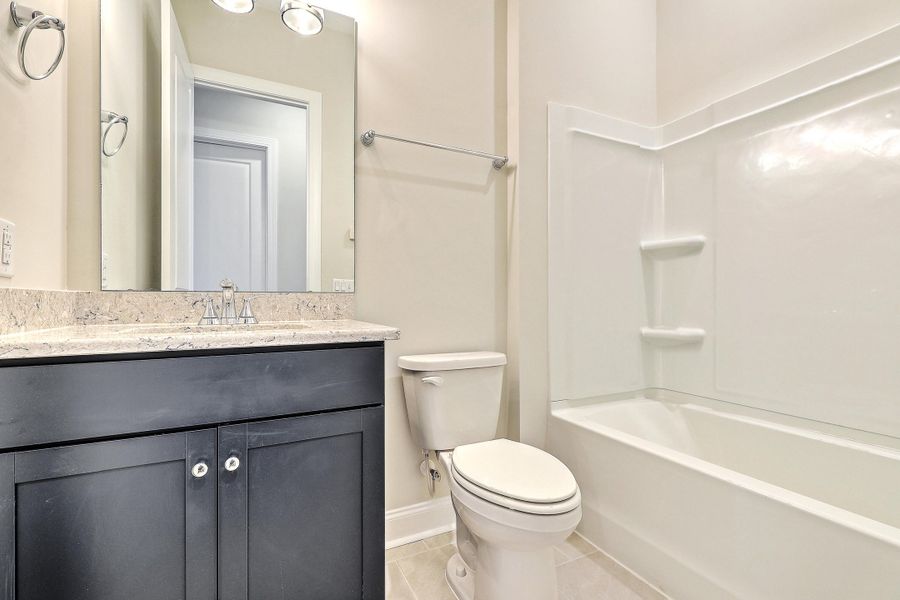 Furnished interior view inside a new home in K. Hovnanian's® Four Seasons at Lakes of Cane Bay, Summerville (Image 5).