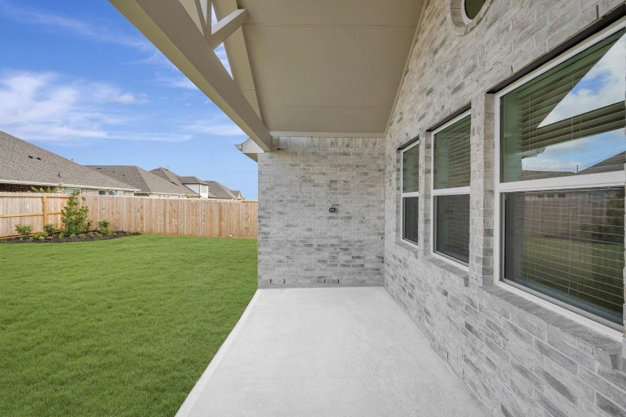Relax outside on the covered patio Relax outside on the covered patio