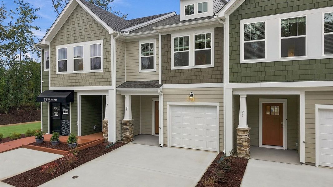 Front exterior of a new home in Brookland Place, Hendersonville, NC, highlighting curb appeal (Image 22). Front exterior of a new home in Brookland Place, Hendersonville, NC, highlighting curb appeal (Image 22).