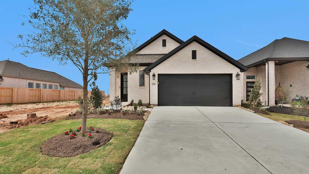 Front exterior of a new home in Jordan Ranch, Fulshear, TX, highlighting curb appeal (Image 2).