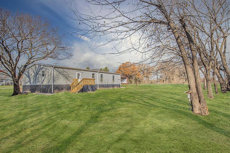 Front exterior of a new home in , Azle, TX, highlighting curb appeal (Image 13).