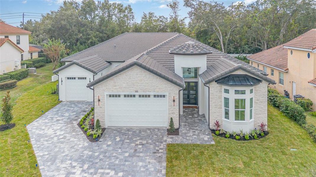 Front exterior of a new home in , Lake Mary, FL, highlighting curb appeal (Image 22). Front exterior of a new home in , Lake Mary, FL, highlighting curb appeal (Image 22).