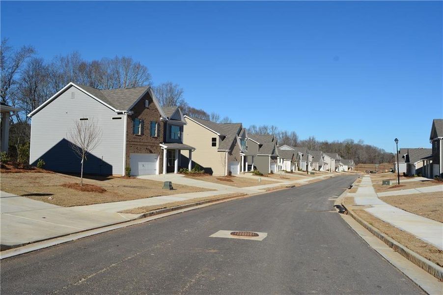 Front exterior of a new home in , Braselton, GA, highlighting curb appeal (Image 16). Front exterior of a new home in , Braselton, GA, highlighting curb appeal (Image 16).