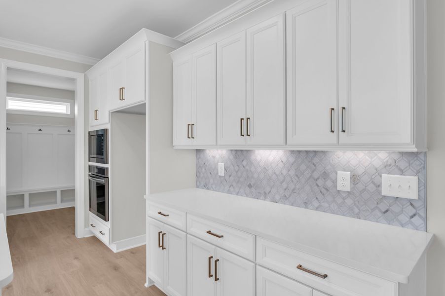 Representative furnished interior of a home built from the The Whitley by RobuckHomes in Windwater, Hampstead (Image 66).