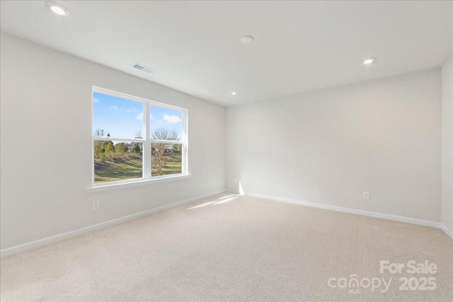 Primary Suite Facing Unobstructed Views and Mature Trees.