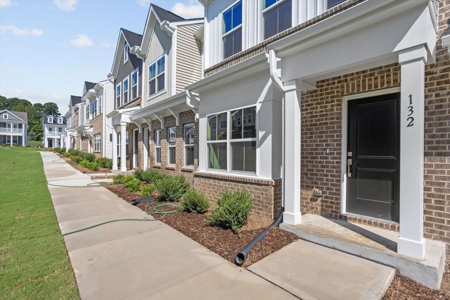 Exterior details and patio area of a home in Renaissance at White Oak, Garner (Image 3). Exterior details and patio area of a home in Renaissance at White Oak, Garner (Image 3).