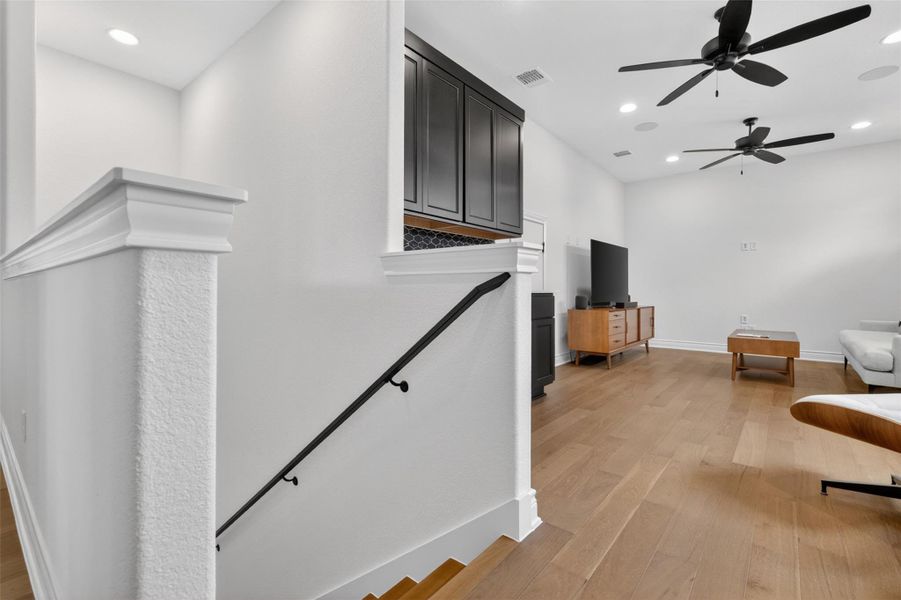 Hardwood floors and dual ceiling fans enhance the comfortable living space. Hardwood floors and dual ceiling fans enhance the comfortable living space.