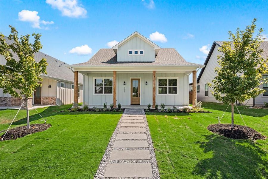 Front exterior of a new home in , Justin, TX, highlighting curb appeal (Image 24).