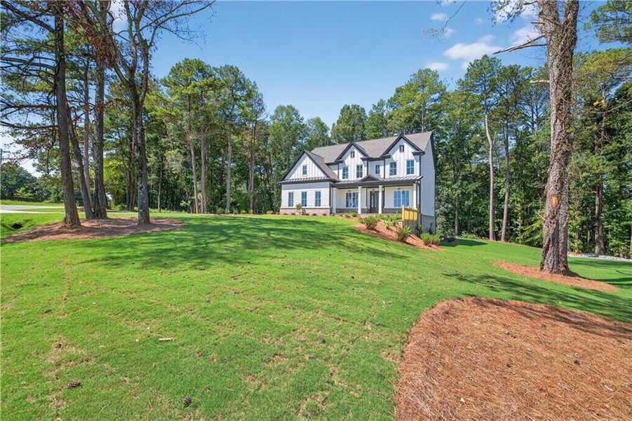 Front exterior of a new home in , Cumming, GA, highlighting curb appeal (Image 36). Front exterior of a new home in , Cumming, GA, highlighting curb appeal (Image 36).